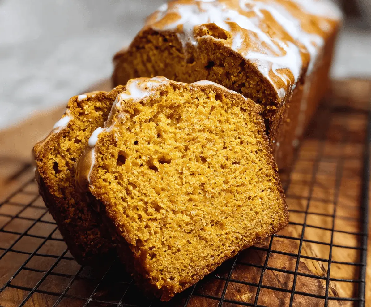 A slice of moist and fluffy sweet potato bread with a golden crust, showcasing its soft interior and appealing texture.
