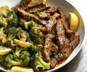 Juicy lemon garlic steak with fresh broccoli in a skillet, ready to serve for a flavorful meal