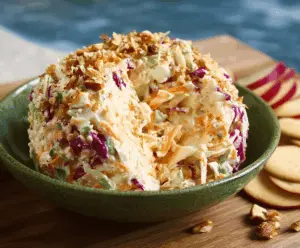 Delicious cheese slaw with fresh vegetables and melted cheese, perfect for a summer salad.