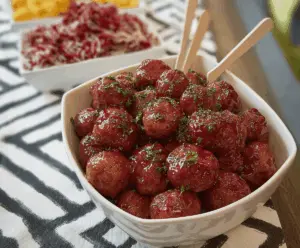 Delicious homemade Crock Pot party meatballs served in a festive setting with toothpicks.