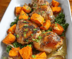 Delicious Honey Garlic Chicken served with roasted sweet potatoes on a platter