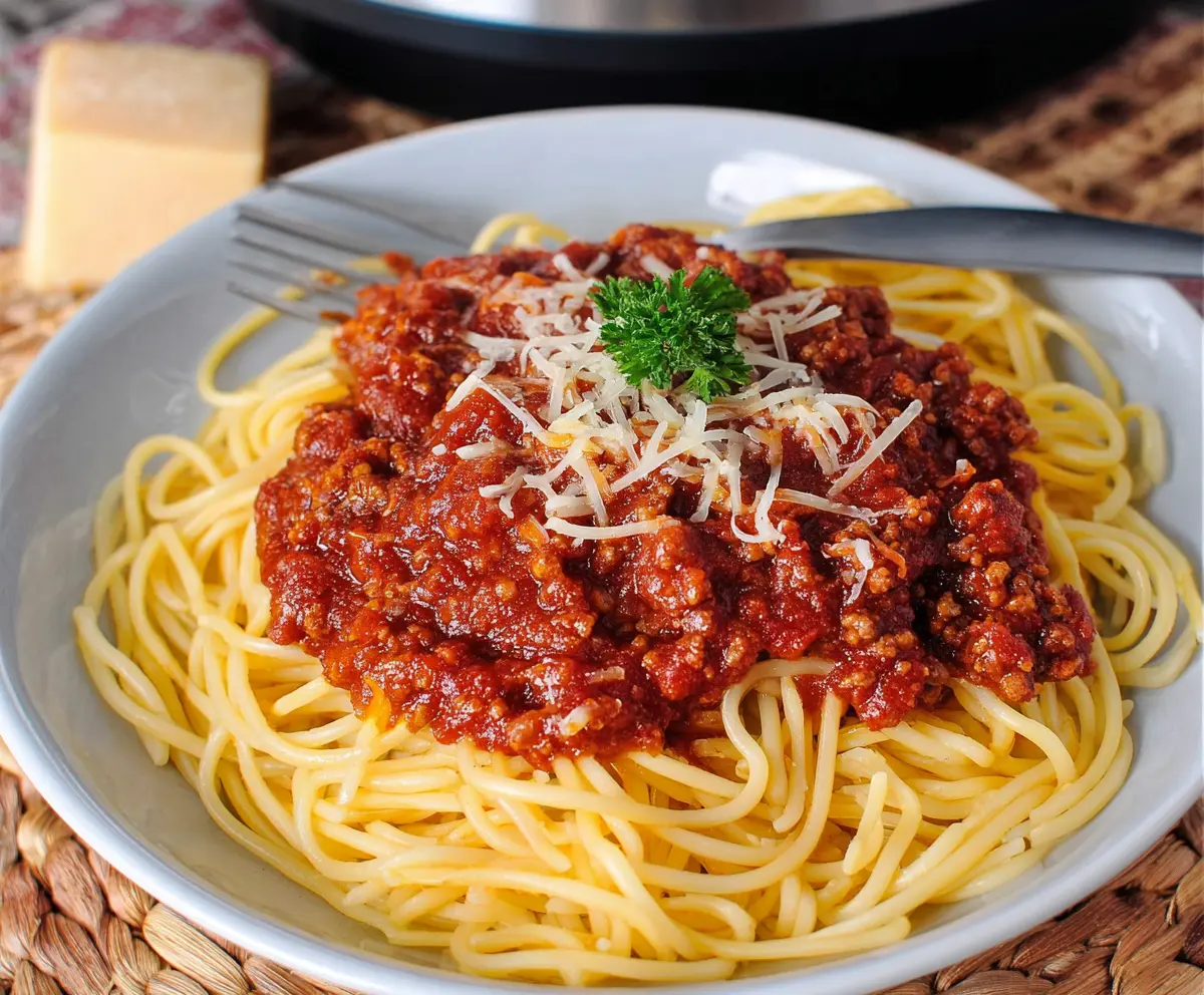 Delicious Crockpot spaghetti with rich meat sauce served in a bowl for a hearty meal.