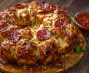 Delicious Pizza Monkey Bread with melted cheese, pepperoni, and fresh herbs ready to serve.