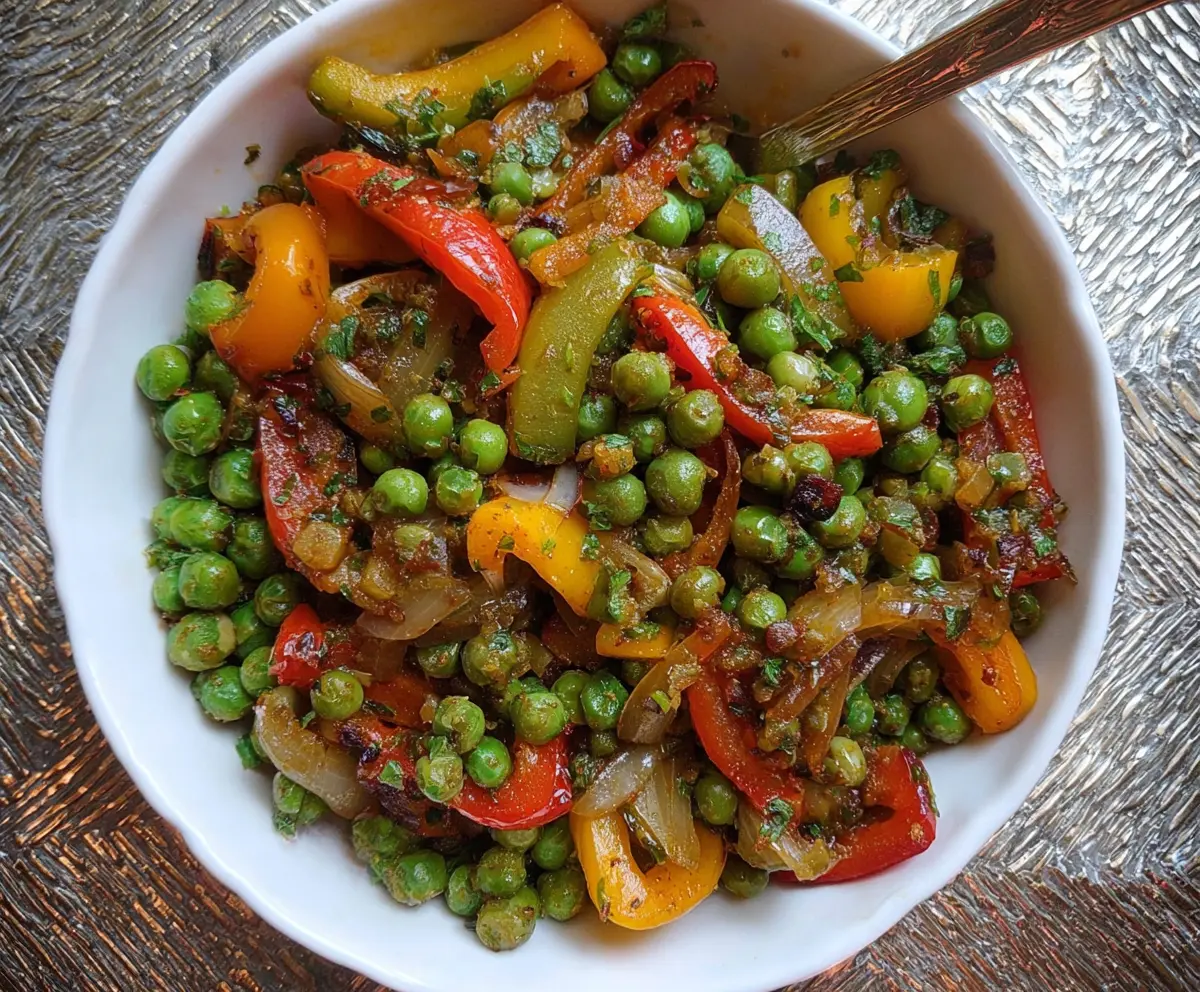 Colorful peas and peppers stir fry with fresh vegetables and vibrant presentation.
