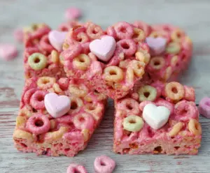 Delicious pink cereal bars with a glossy finish, perfect for a sweet snack or dessert.