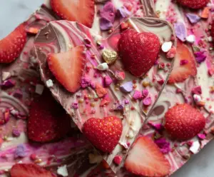 Delicious homemade Strawberry Heart Bark with fresh strawberries and melted chocolate.
